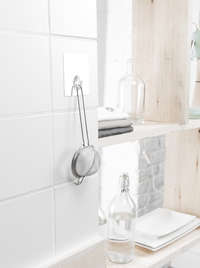 Gancho transparente reposicionable